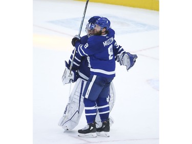 Toronto Maple Leafs Jack Campbell G (36) is congratulated by Jake Muzzin D (8) after defeating the Montreal Canadiens 3-2 in Toronto on Wednesday April 7, 2021. Jack Boland/Toronto Sun/Postmedia Network