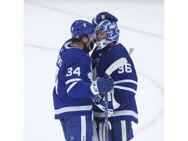 Toronto Maple Leafs Jack Campbell G (36) is congratulated by Auston Matthews C (34) after defeating the Montreal Canadiens 3-2 in Toronto on Wednesday April 7, 2021. Jack Boland/Toronto Sun/Postmedia Network