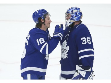 Toronto Maple Leafs Jack Campbell G (36) is congratulated by Mitch Marner RW (16) after defeating the Montreal Canadiens 3-2 in Toronto on Wednesday April 7, 2021. Jack Boland/Toronto Sun/Postmedia Network