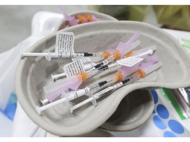 Dr. Tina Kerelska an anesthesiologist helps to vaccinate some of the 1,500 people with Pfizer-BioNTech COVID-19 vaccine on Wednesday at the Humber River Hospital Vaccination Clinic held at Downsview Arena on Wednesday April 21, 2021. Jack Boland/Toronto Sun/Postmedia Network