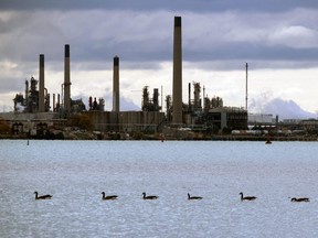Paul Morden/The Observer
Industry smokestacks are shown from across Sarnia Bay on the St. Clair River.