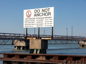 A signpost marks the presence of high pressure petroleum pipelines including Enbridge's Line 5 pipeline, which Michigan Governor Gretchen Whitmer ordered to be shut down in May 2021, in Sarnia on March 20, 2021.