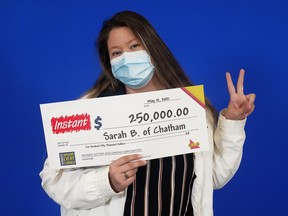 Sarah Bardoel of Chatham with her $250,000 cheque from playing the Instant Jackpot lottery.