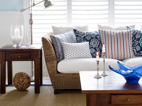 Colin and Justin created this beachy, summery vibe using a textural floor rug, wall panelling, layers of rattan and sky blue paint by Benjamin Moore. SUPPLIED
