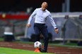 TFC head coach Chris Armas kicks the ball during this week's match against Cruz Azul.