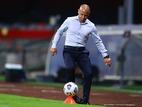 TFC head coach Chris Armas kicks the ball during this week's match against Cruz Azul.