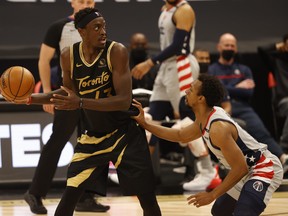 Toronto Raptors forward Pascal Siakam  drives to the basket as Washington Wizards guard Ish Smith defends on Thursday night.