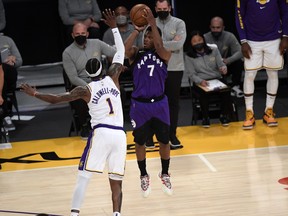 Kyle Lowry #7 of the Toronto Raptors shoots and scores a three-point basket, and is fouled by Kentavious Caldwell-Pope #1 of the Los Angeles Lakers during the second half at Staples Center on May 2, 2021 in Los Angeles.