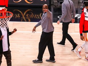 Head Coach Nate McMillan of the Atlanta Hawks celebrates while walking off the court after a 125-124 victory over the Washington Wizards at State Farm Arena on May 10, 2021 in Atlanta, Georgia.