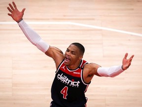 Russell Westbrook #4 of the Washington Wizards celebrates after scoring to cut lead with under a minute left in the fourth quarter of a game between the Washington Wizards and the Atlanta Hawks at State Farm Arena on May 10, 2021 in Atlanta, Georgia.