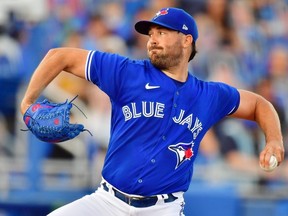 Robbie Ray of the Toronto Blue Jays delivers a pitch to the Tampa Bay Rays in the first inning at TD Ballpark on May 22, 2021 in Dunedin, Florida.