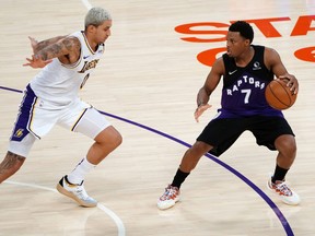 Toronto Raptors guard Kyle Lowry (7) controls the ball against Los Angeles Lakers forward Kyle Kuzma (0) during the second half at Staples Center May 2, 2021.