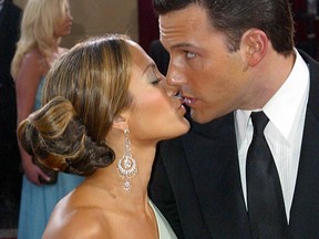 Jennifer Lopez gives a kiss to Ben Affleck at the arrivals of the 75th Academy Awards in Hollywood on March 23, 2003.