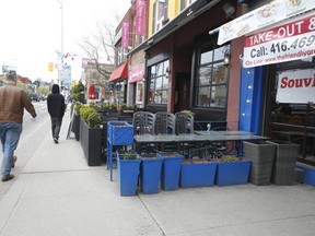 Chairs are tucked away on a patio outside a Danforth Ave. restaurant at Logan Ave.