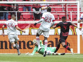 Toronto FC goalkeeper Alex Bono (25) makes a save on a shot on goal by New York Red Bulls forward Fabio Roberto Gomes Netto (9) in the second half at Red Bull Arena.