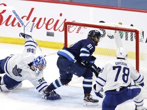 Jets winger Kyle Connor dekes Leafs goaltender Jack Campbell in the second period at Bell MTS Place on Friday night.