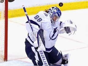 Lightning goaltender Andrei Vasilevskiy makes a save with his mask against the Panthers in Game 2 of the First Round of the 2021 Stanley Cup Playoffs at the BB&T Center in Sunrise, Fla., Tuesday, May 18, 2021.