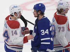 Maple Leafs' Auston Matthews (right) congratulates Montreal Canadiens' Nick Suzuki after the Canadiens beat the Leafs 3-1 in Game 7 of their first-round series at Scotiabank Arena on Monday, May 31, 2021.