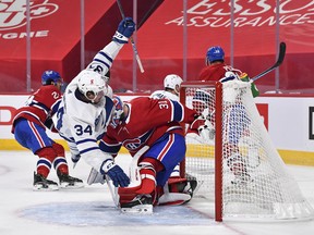 Maple Leafs centre Auston Matthews flies over Canadiens Carey in Montreal on Saturday night. Matthews' lack of production is one of the reason's Toronto finds itself having to play a Game 7, at home on Monday night.