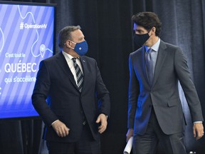 Quebec Premier Francois Legault, left and Prime Minister Justin Trudeau chat in March.