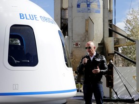 Amazon and Blue Origin founder Jeff Bezos addresses the media about the New Shepard rocket booster and Crew Capsule mockup at the 33rd Space Symposium in Colorado Springs, Colorado, April 5, 2017.
