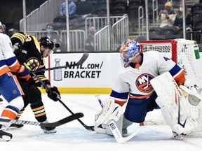 Boston Bruins centre Brad Marchand scores a goal past New York Islanders goaltender Semyon Varlamov during the second period at TD Garden in Boston, Mass. on May 10, 2021.