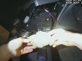 Bodycam footage shows Springfield, Ill., cops searching the car of Dartavius Barnes. Cops say they found drugs in an urn, but was actually Barnes’ daughter’s ashes.