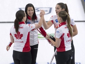 Team Canada (left to right) 3rd Val Sweeting, skip Kerri Einarson, 2nd Shannon Birchard and lead Briane Meilleur celebrate after defeating Team Estonia 10-4 at the World Woman's World Curling Championship in Calgary, Wednesday, May 5, 2021.