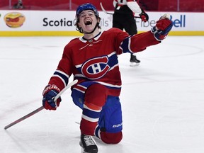 Montreal Canadiens forward Cole Caufield reacts after scoring the winning goal against the Ottawa Senators during the overtime period at the Bell Centre. This was Caufield's first NHL goal.