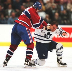 Shayne Corson, then with the Montreal Canadiens, fights Leafs pugilist Tie Domi in this game from 2000. The two would be teammates the next season when Corson signed as a free agent in Toronto. MARK O’NEILL/SUN FILES