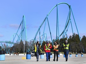 Health-care workers get ready to take patients at a drive-thru COVID-19 mass vaccination site at Canada's Wonderland during the COVID-19 pandemic on March 29, 2021.