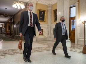 Dr. David Williams (right), Ontario's chief medical officer of health, and Adalsteinn Brown, co-chair of Ontario's COVID-19 science advisory table arrive to deliver updated projections at Queen’s Park in Toronto on Friday, April 16, 2021.