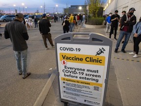 Hundreds of people line up for the Peel Region Doses After Dark vaccination clinic in Mississauga on Saturday, May 15, 2021.