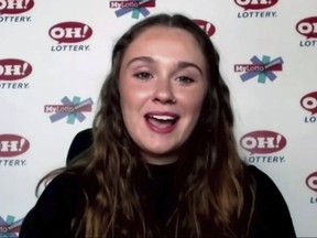 In this still image, taken from video by the Office of the Ohio Governor, Abbigail Bugenske, 22, from Cincinnati, the first winner of Ohio's first $1 million Vax-a-Million vaccination incentive prize, is interviewed during a news conference, Thursday, May 27, 2021.