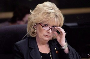 Senator Pamela Wallin adjusts her glasses at the start of a meeting, February 11, 2013 in Ottawa.