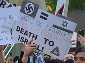 A sign displayed at Saturday's pro-Palestinian protest at Nathan Phillips Square.