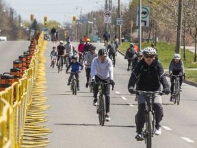 Cyclists make their way along a closed-off Lake Shore Blvd. E. (eastbound lanes only), between Leslie Street and Woodbine Ave. as a part of ActiveTO on  May 1, 2021.
