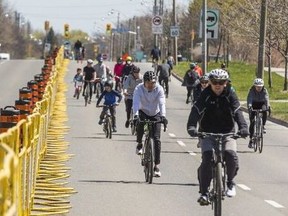 Cyclists make their way along a closed-off Lake Shore Blvd. E. as part of ActiveTO on May 1, 2021.