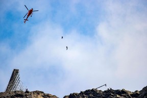 Tom Cruise comes off a motobike during the filming of the next Mission Impossible film in Hellesylt, Norway on Sept. 6, 2020.