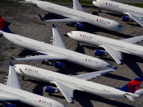 Delta Air Lines passenger planes are seen parked due to flight reductions made to slow the spread of coronavirus at Birmingham-Shuttlesworth International Airport in Birmingham, Alabama, March 25, 2020.