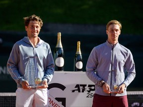 Norway's Casper Ruud, left, poses with next to Canada's Denis Shapovalov after winning the ATP 250 Geneva Open tennis final match in Geneva on May 22, 2021.