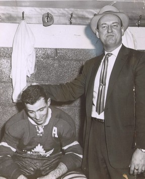 Leafs coach and general manager Punch Imlach congratulates Dick Duff after his overtime goal gave Toronto its only win of the 1959 Stanley Cup final against Montreal. SUN FILES