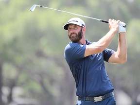 Dustin Johnson of the United States plays his shot from the 17th tee during the final round of the Valspar Championship on the Copperhead Course at Innisbrook Resort on May 2, 2021 in Palm Harbor, Fla.