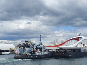 The west half of the Commissioners St. bridge arrives in Toronto on Tuesday, May 11, 2021.