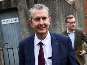 Northern Ireland's agriculture minister, Edwin Poots, walks outside the Democratic Unionist Party headquarters in Belfast, May 14, 2021.
