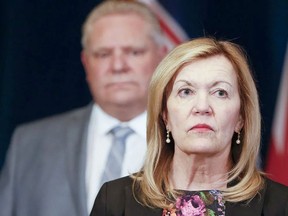 In this file photo, Christine Elliott, Deputy Premier and Minister of Health, stands in front of Premier Doug Ford.