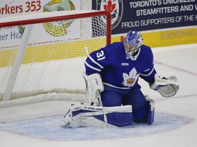 Goalie Frederik Andersen makes a toe save during first-period action during his conditioning stint with the AHL's Marlies in Toronto on Thursday, May 6, 2021.