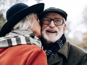 Close up of pretty woman that kissing her husband