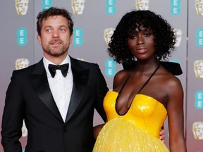 Canadian-U.S. actor Joshua Jackson and his wife British actress Jodie Turner Smith pose on the red carpet upon arrival at the BAFTA British Academy Film Awards at the Royal Albert Hall in London on Feb. 2, 2020.