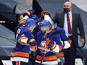 The New York Islanders celebrate a victory over the Pittsburgh Penguins at the Nassau Coliseum on May 26, 2021 in Uniondale, New York.